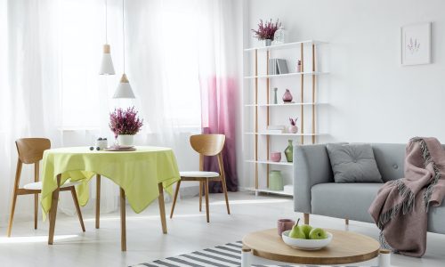 living-and-dining-room-in-modern-apartment-with-grey-couch-and-w.jpg